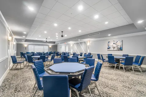 a large dining hall with stainless steel appliances lots of counter space