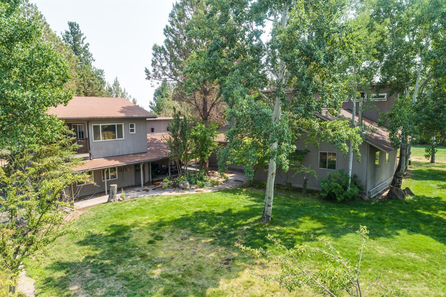 19005 Couch Market Road Bend, OR 97703 - Photo 22 of 22 a view of a house with a yard porch and sitting area