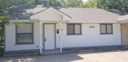 a view of a house with a tub and garage