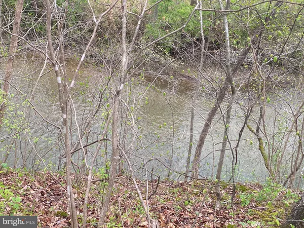 a backyard of a house with lots of green space and shower
