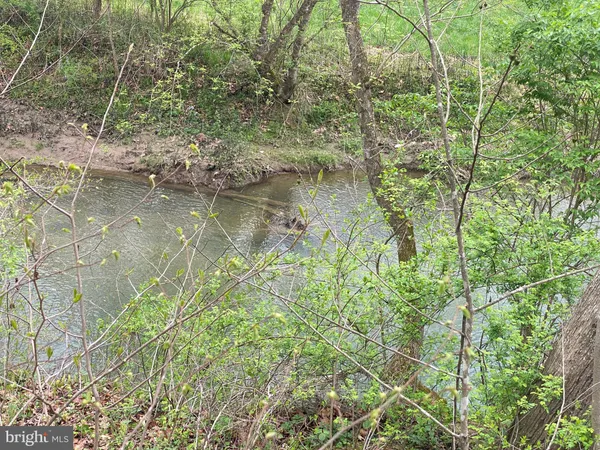 a view of lake with green space