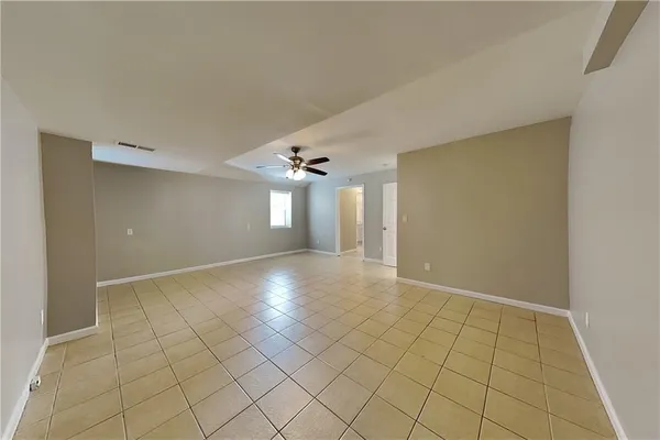 a view of an empty room with windows