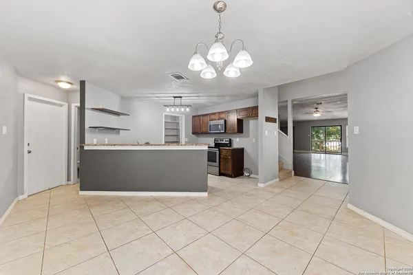 a view of a kitchen with a sink and cabinets