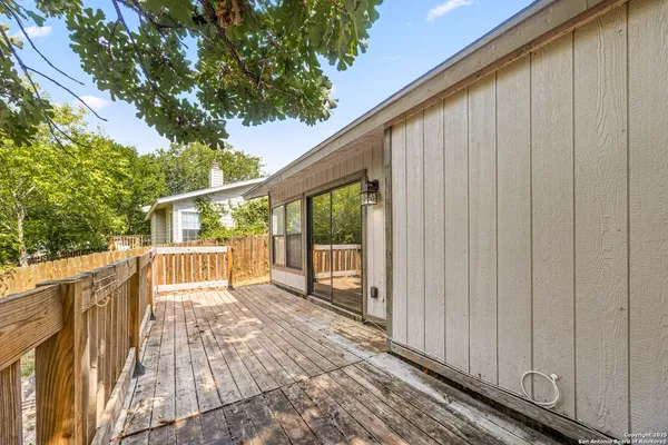 a view of a balcony with wooden floor