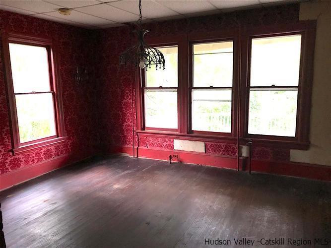 1135 Creek Locks Road Rosendale, NY 12411 - Photo 2 of 8 a view of an empty room with wooden floor and a window