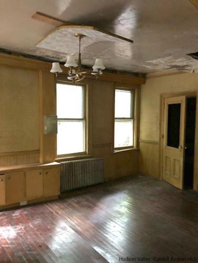 1135 Creek Locks Road Rosendale, NY 12411 - Photo 6 of 8 a view of an empty room with a window and wooden floor