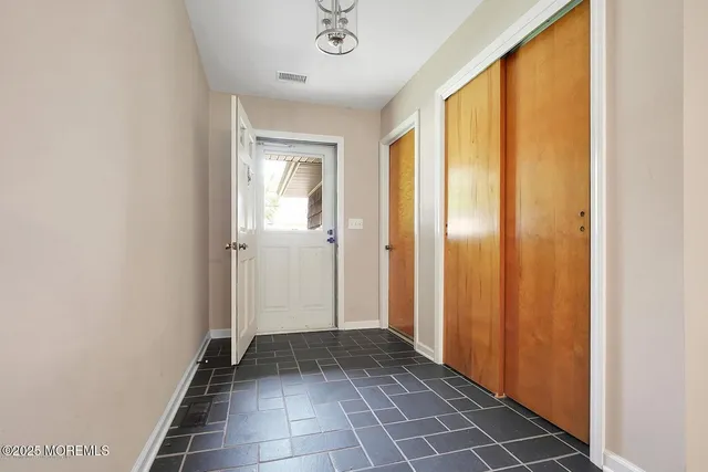 a view of a hallway with a glass door