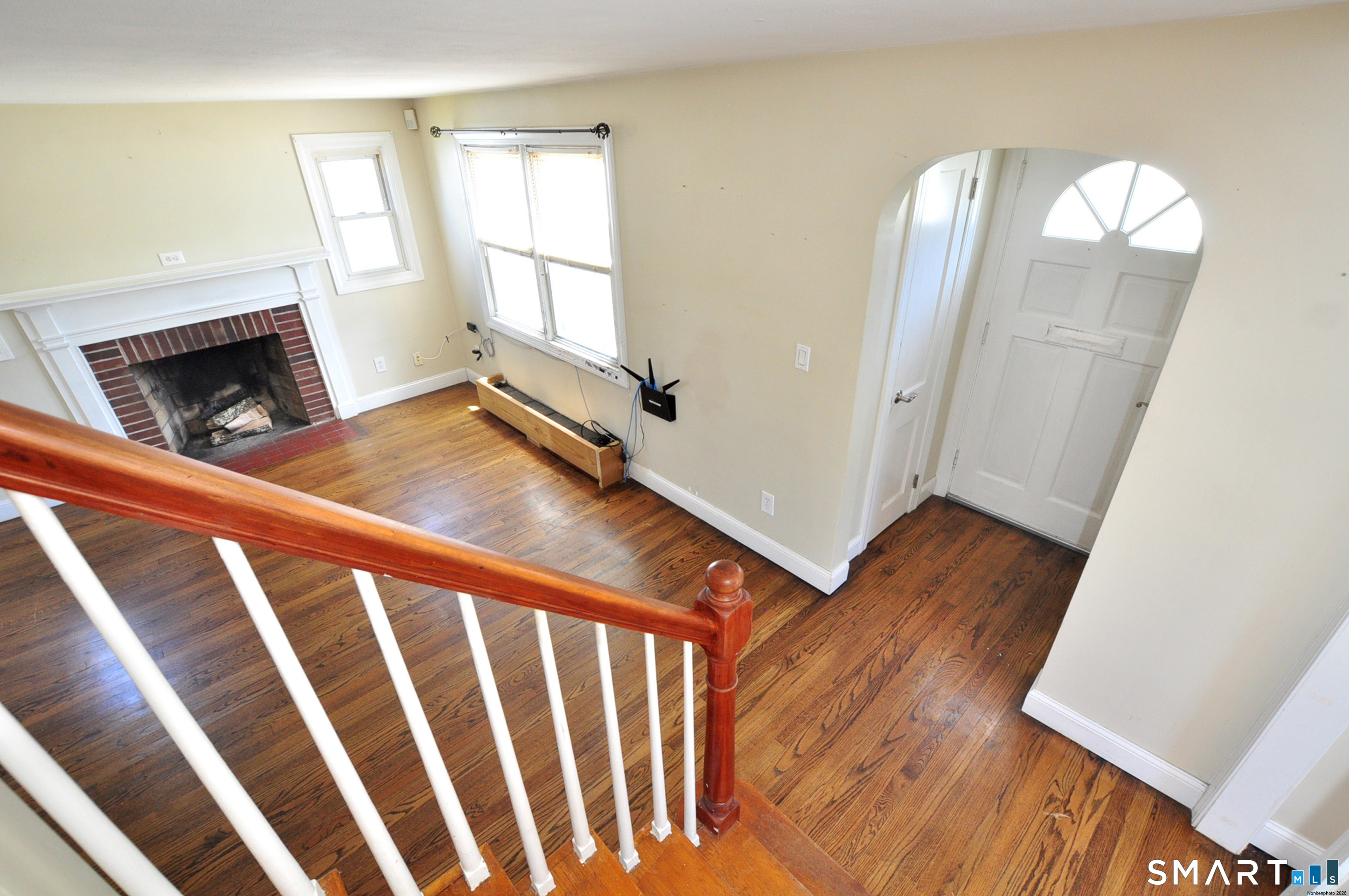 103 West Center Street Manchester, CT 06040 - Photo 7 of 29 a view of a livingroom with wooden floor and a fireplace