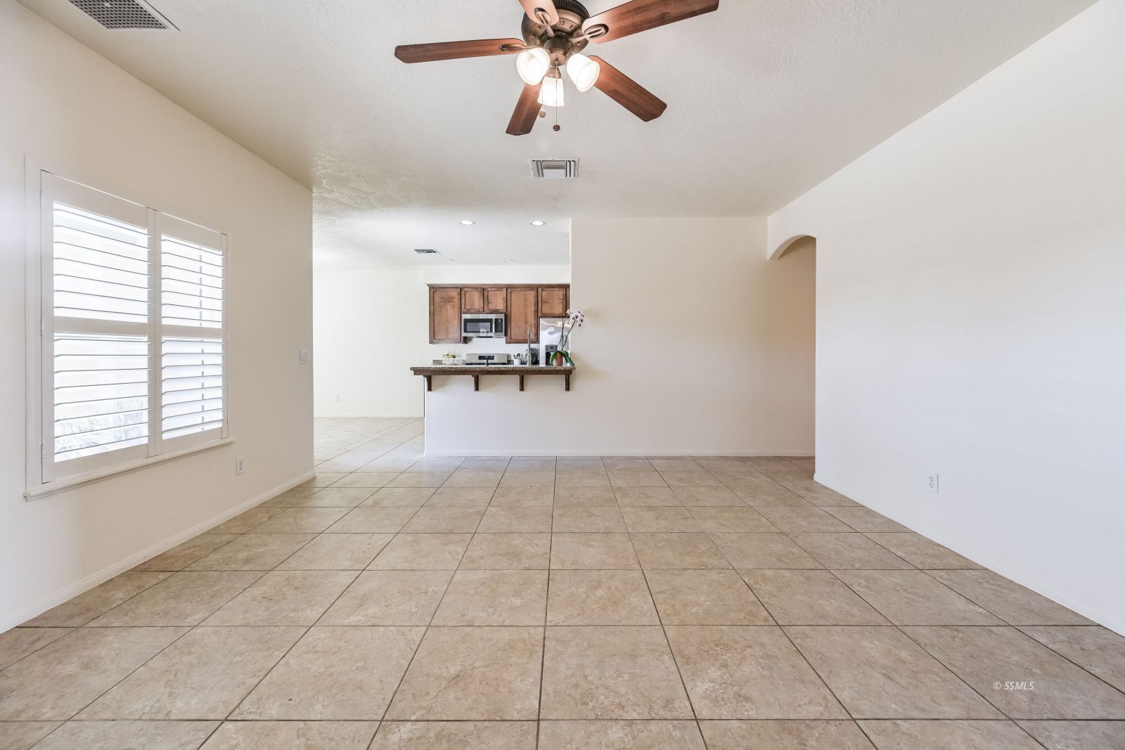 320 South Inyo Street Ridgecrest, CA 93555 - Photo 16 of 42 a view of a livingroom with a ceiling fan and window