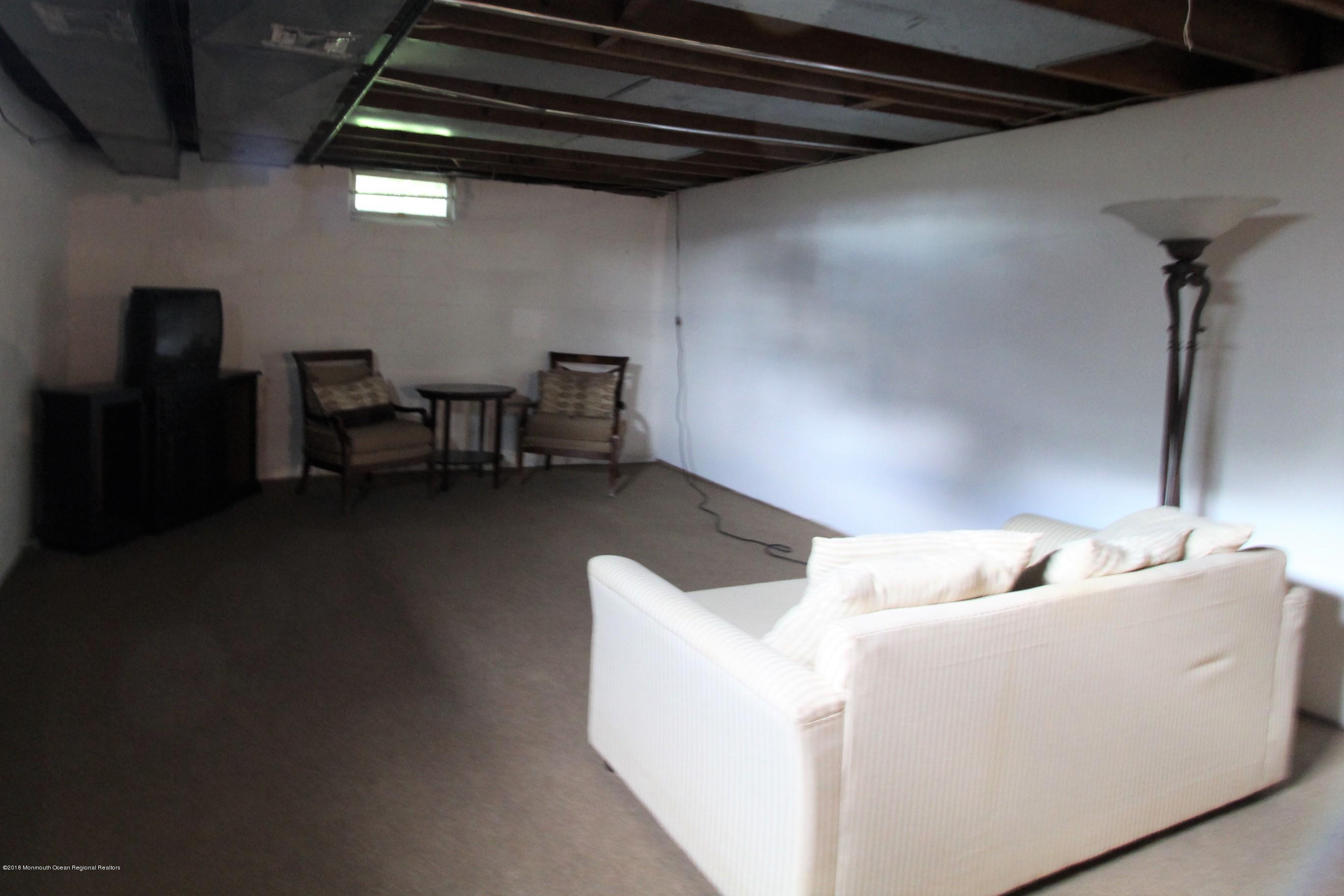 134 Conover Road Morganville, NJ 07751 - Photo 13 of 24 a living room with furniture and a wooden floor