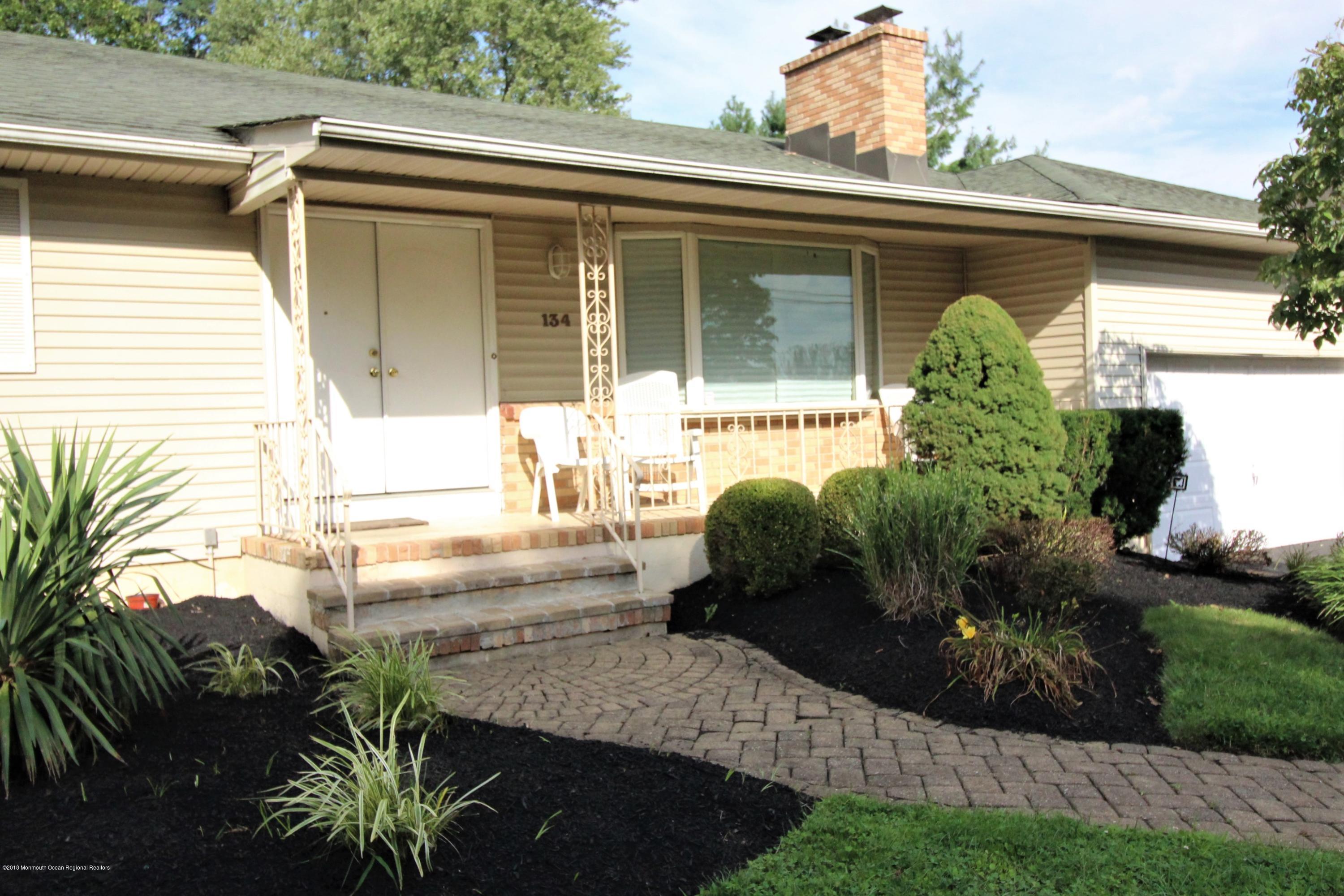 134 Conover Road Morganville, NJ 07751 - Photo 16 of 24 a house view with a garden space