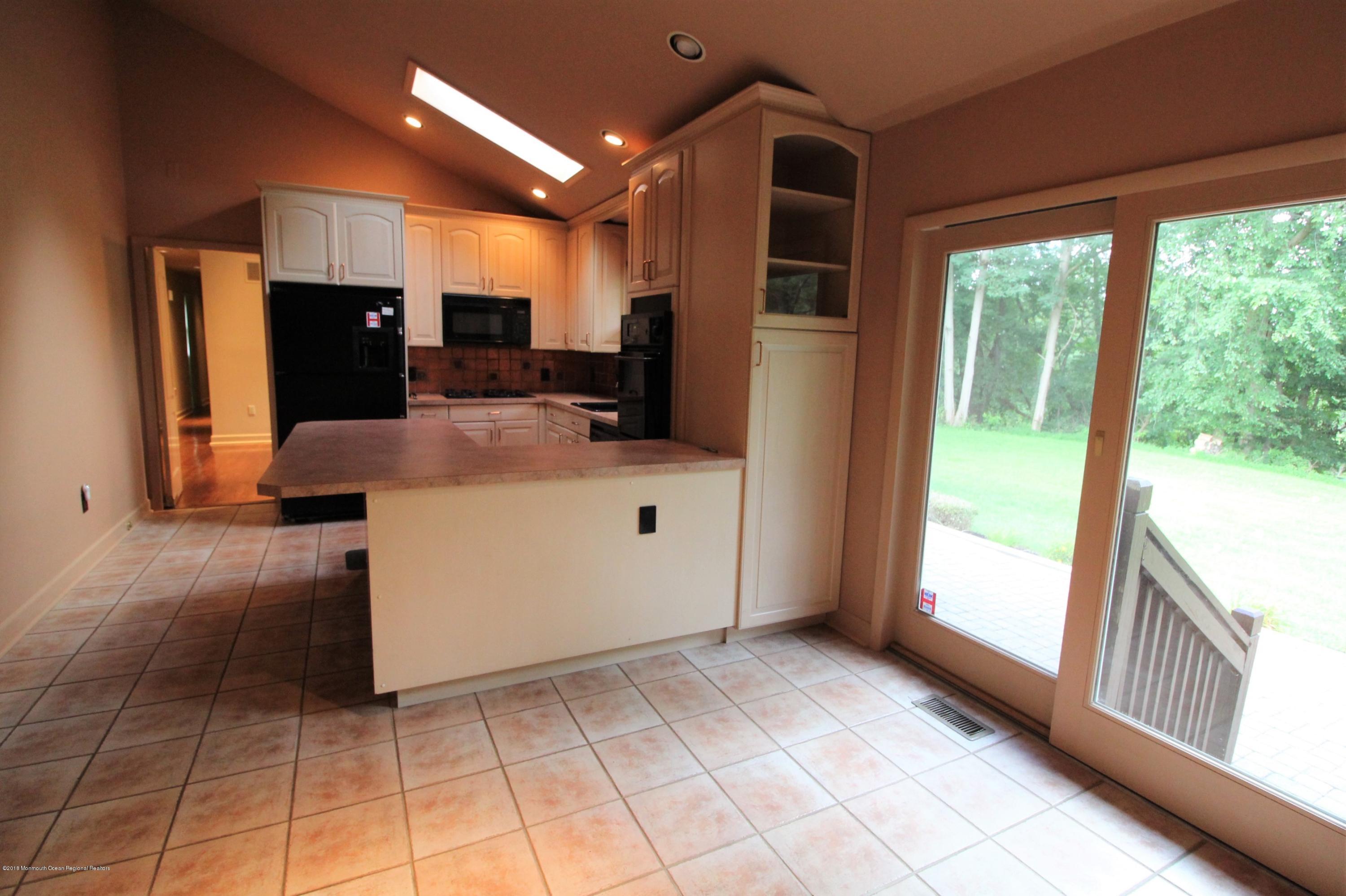 134 Conover Road Morganville, NJ 07751 - Photo 6 of 24 a view of a kitchen with a sink and a refrigerator