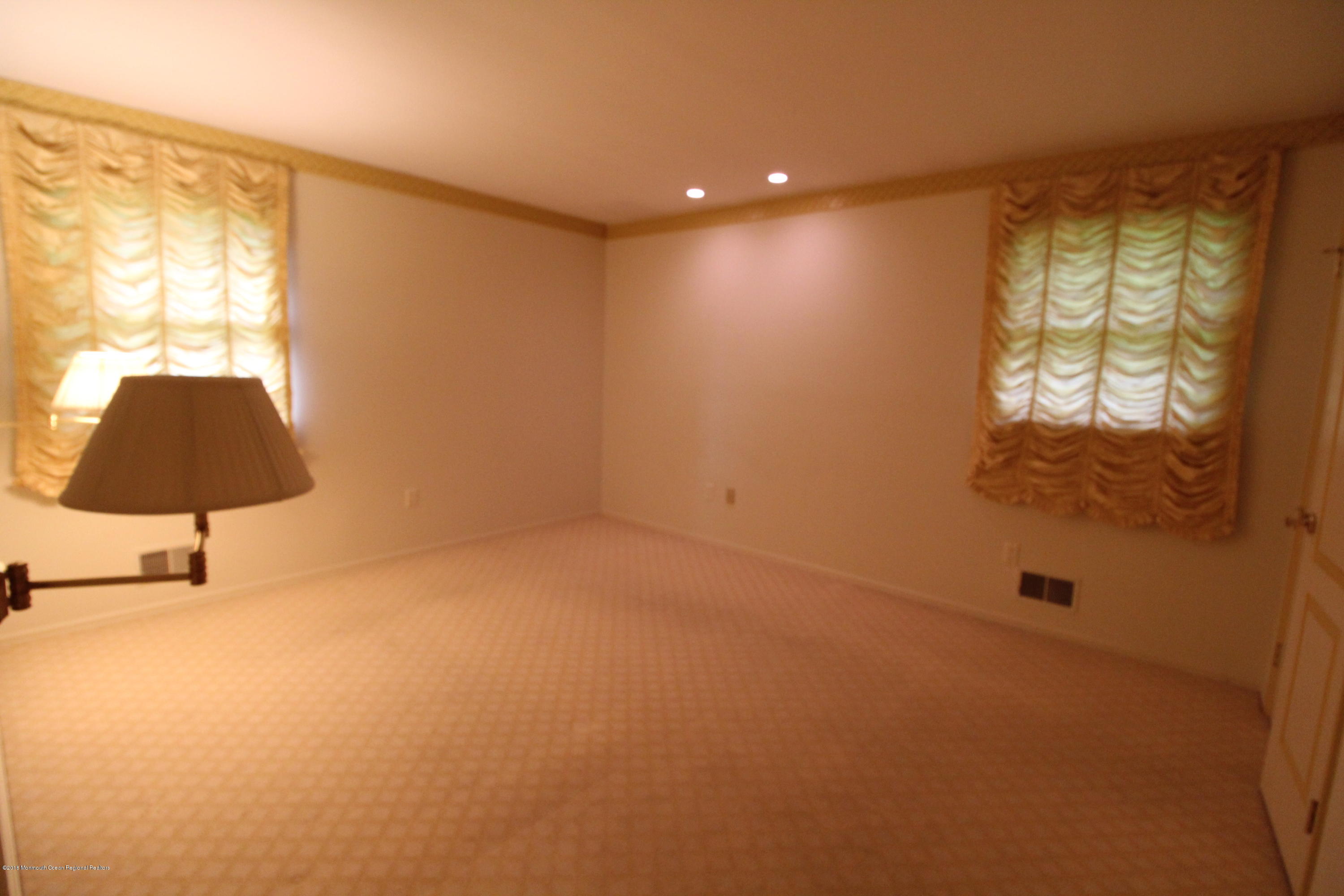 134 Conover Road Morganville, NJ 07751 - Photo 9 of 24 a view of an empty room and window