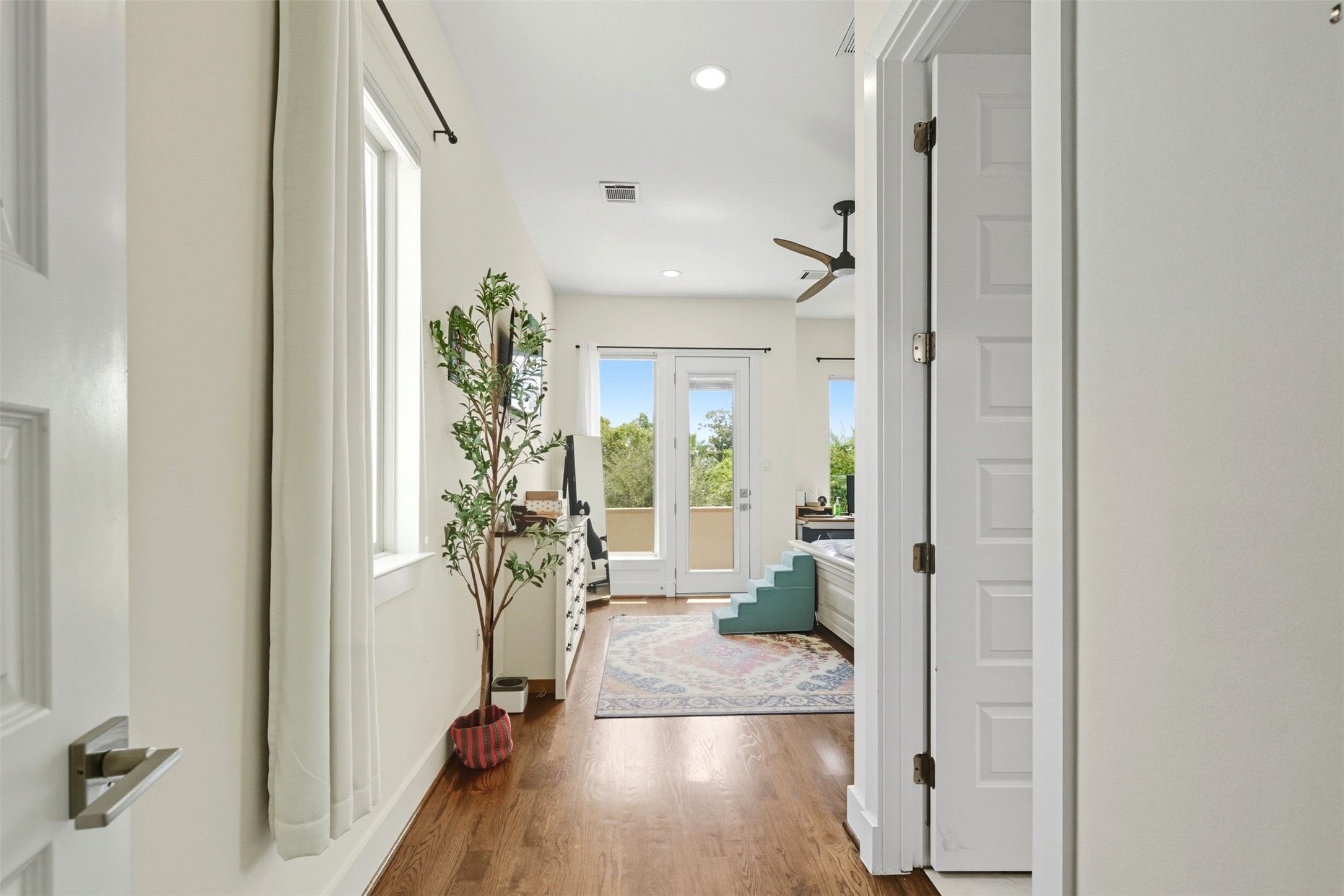 215 Avondale Street Houston, TX 77006 - Photo 22 of 42 a view of entryway with livingroom and wooden floor