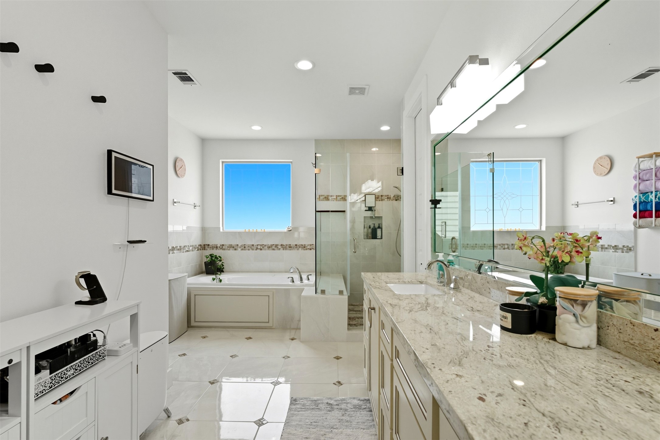 215 Avondale Street Houston, TX 77006 - Photo 26 of 42 a large white kitchen with a sink and living room view