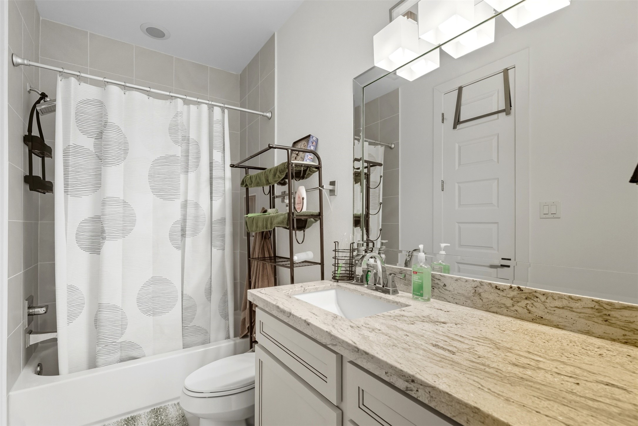 215 Avondale Street Houston, TX 77006 - Photo 32 of 42 a bathroom with a granite countertop sink toilet and shower