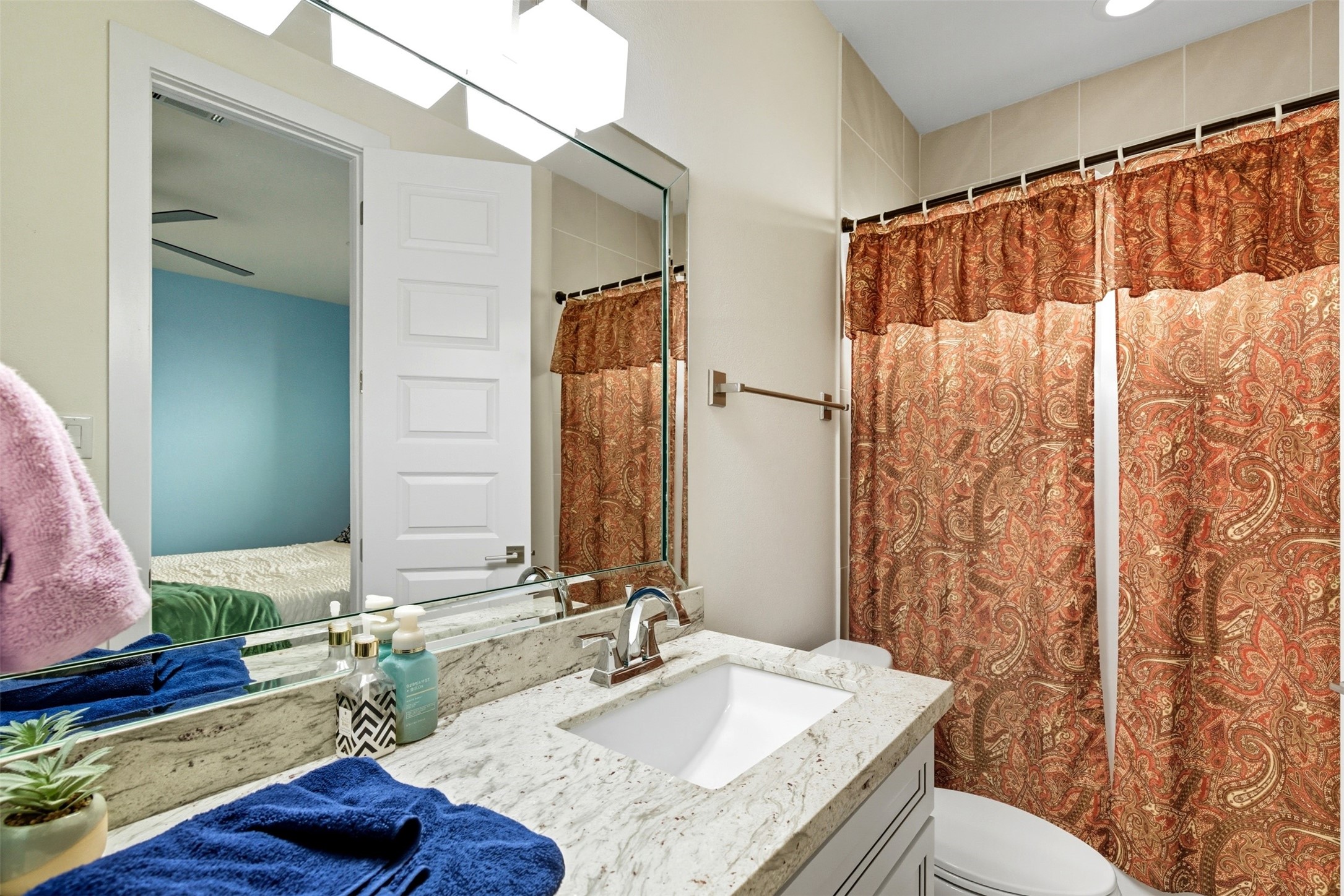 215 Avondale Street Houston, TX 77006 - Photo 6 of 42 a bathroom with a granite countertop sink and a mirror
