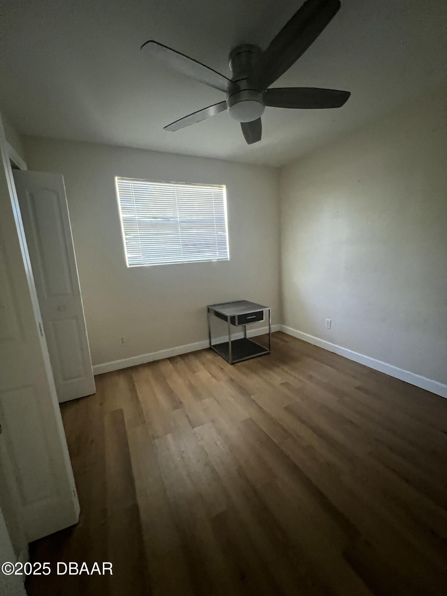 536 Ruth Street Daytona Beach, FL 32114 - Photo 3 of 10 a view of a room with wooden floor and a window