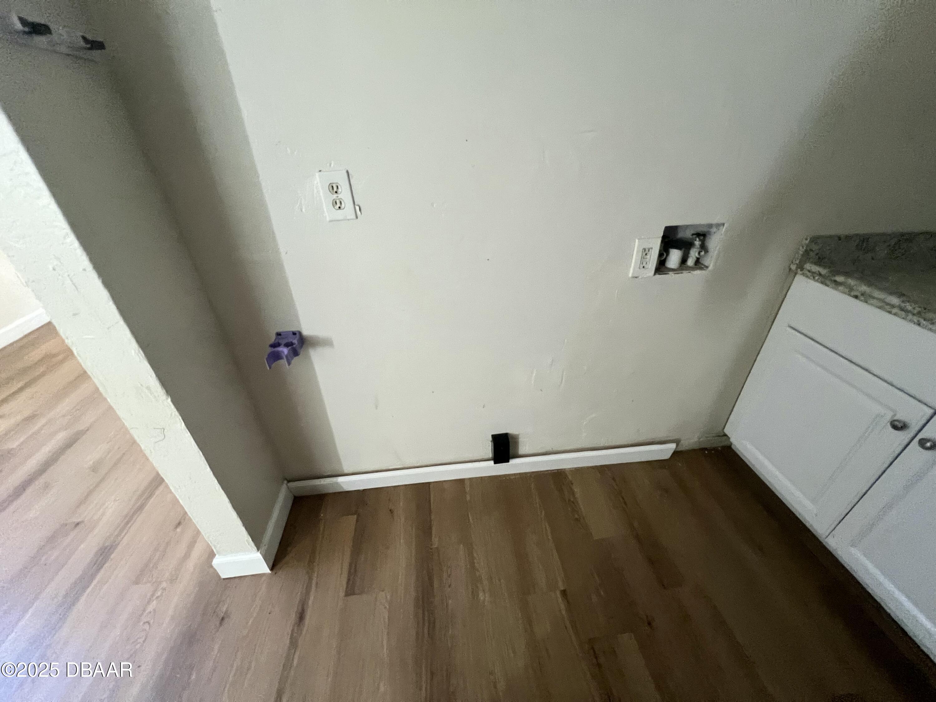 536 Ruth Street Daytona Beach, FL 32114 - Photo 5 of 10 a view of an empty room and wooden floor