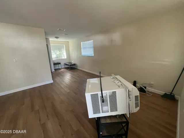 a view of a livingroom with wooden floor