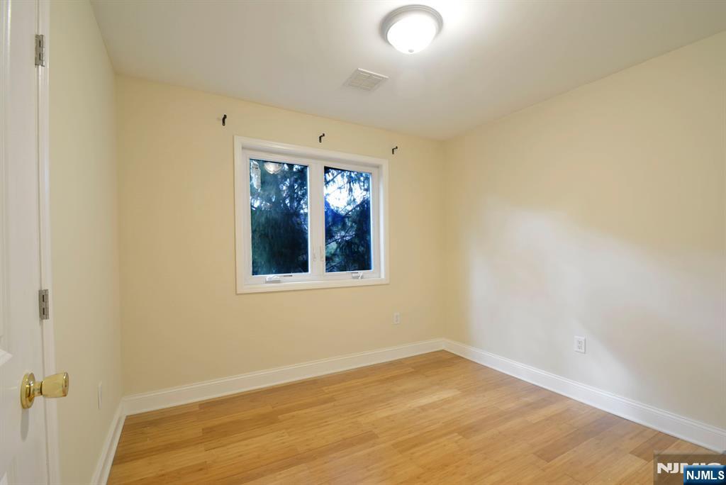 12 Pulaski Place, Unit A Hackensack, NJ 07601 - Photo 14 of 29 an empty room with a window
