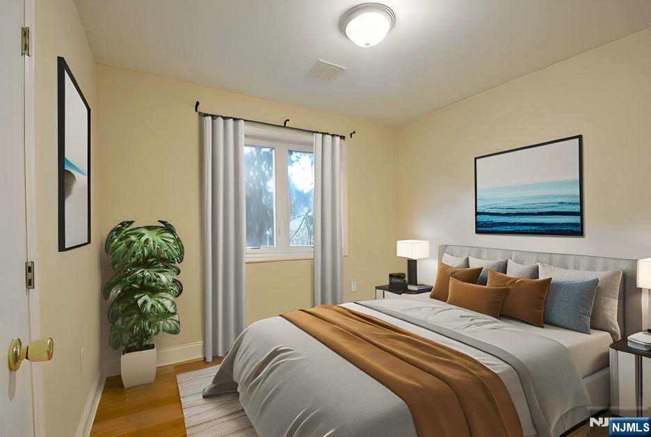 12 Pulaski Place, Unit A Hackensack, NJ 07601 - Photo 15 of 29 a bedroom with bed and a window