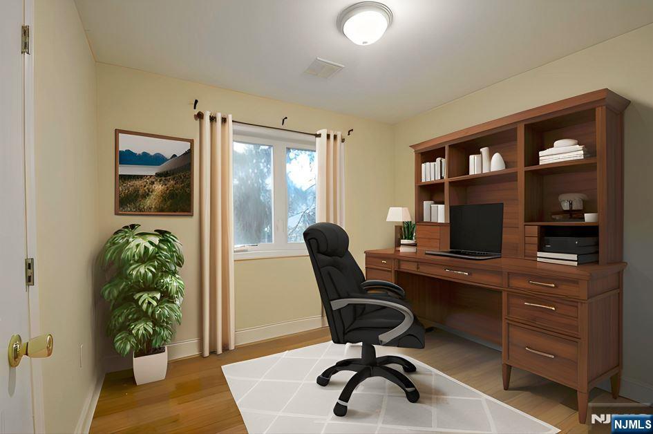 12 Pulaski Place, Unit A Hackensack, NJ 07601 - Photo 16 of 29 a workspace with furniture and a potted plant