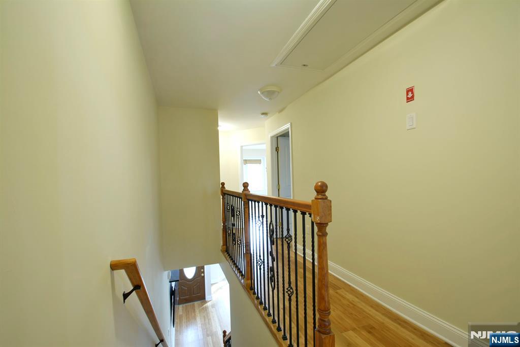 12 Pulaski Place, Unit A Hackensack, NJ 07601 - Photo 20 of 29 a view of a hallway with wooden floor