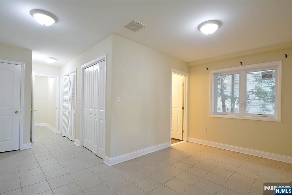 12 Pulaski Place, Unit A Hackensack, NJ 07601 - Photo 21 of 29 a view of an empty room with a window