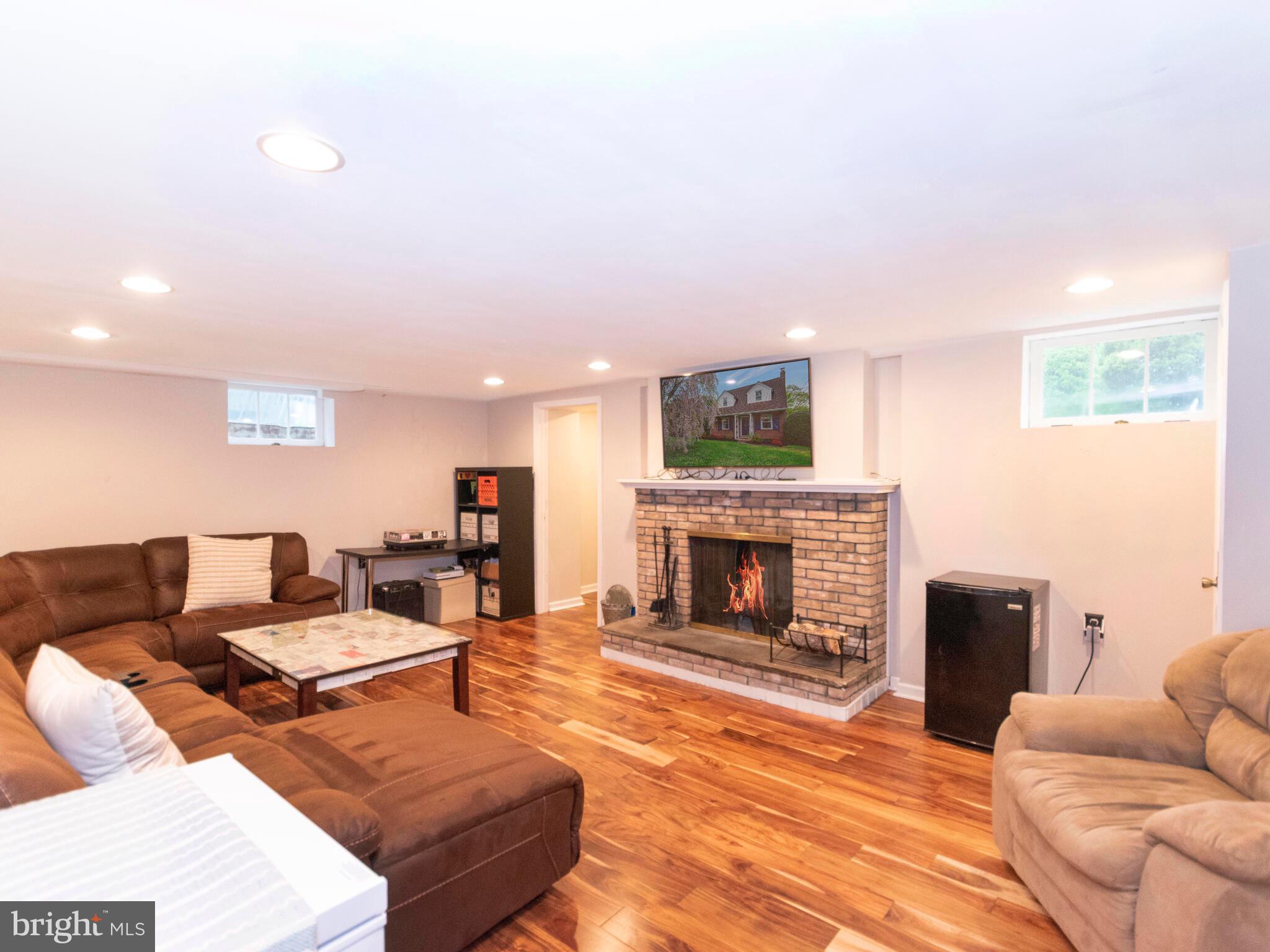 212 Valley View Road Media, PA 19063 - Photo 25 of 28 Finished basement with wood burning fireplace