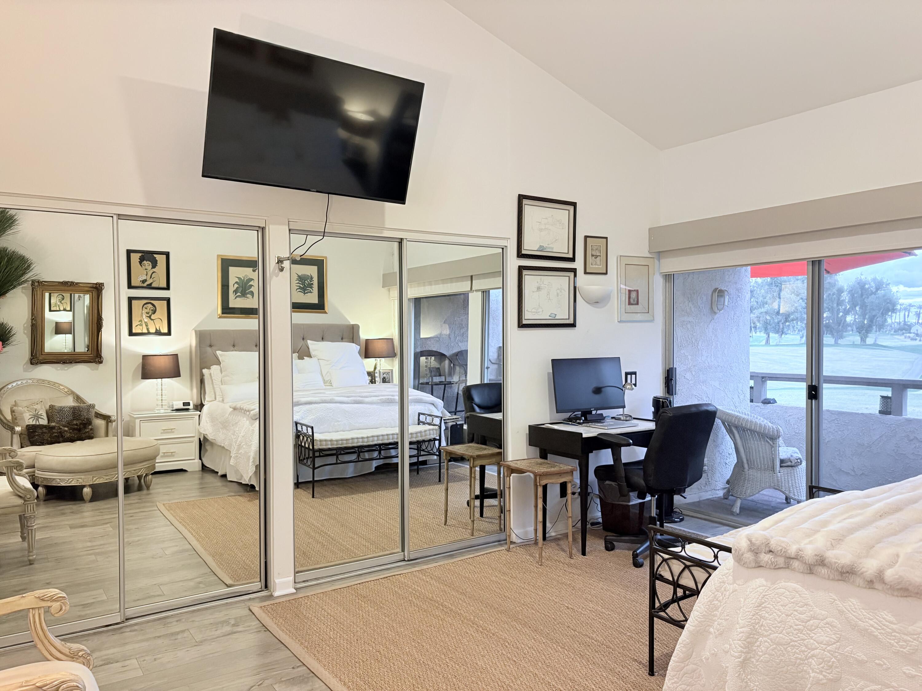 35082 Mission Hills Drive Rancho Mirage, CA 92270 - Photo 15 of 31 a view of a livingroom with workspace and a flat screen tv