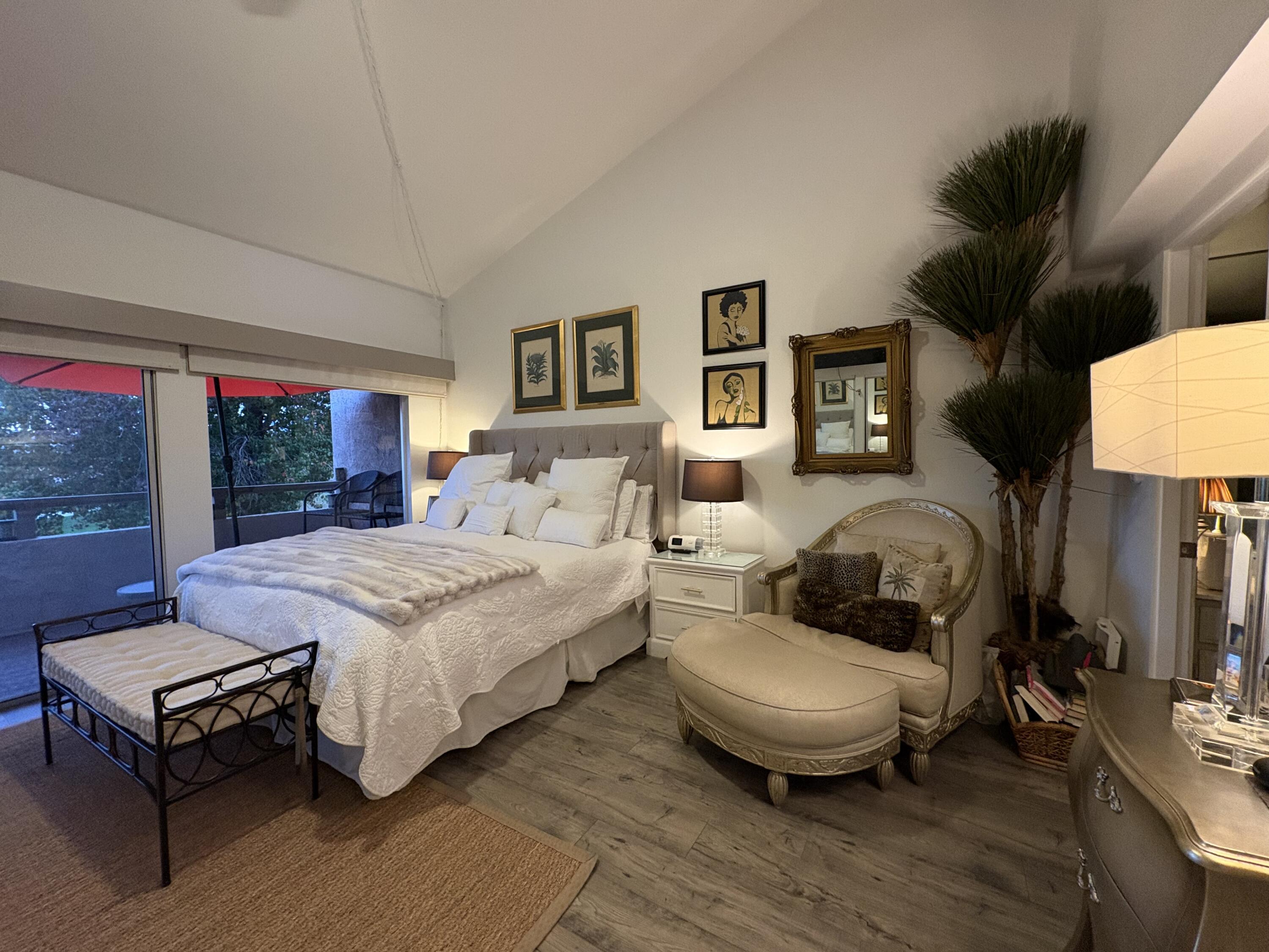 35082 Mission Hills Drive Rancho Mirage, CA 92270 - Photo 16 of 31 a spacious bedroom with a bed wooden floor and window