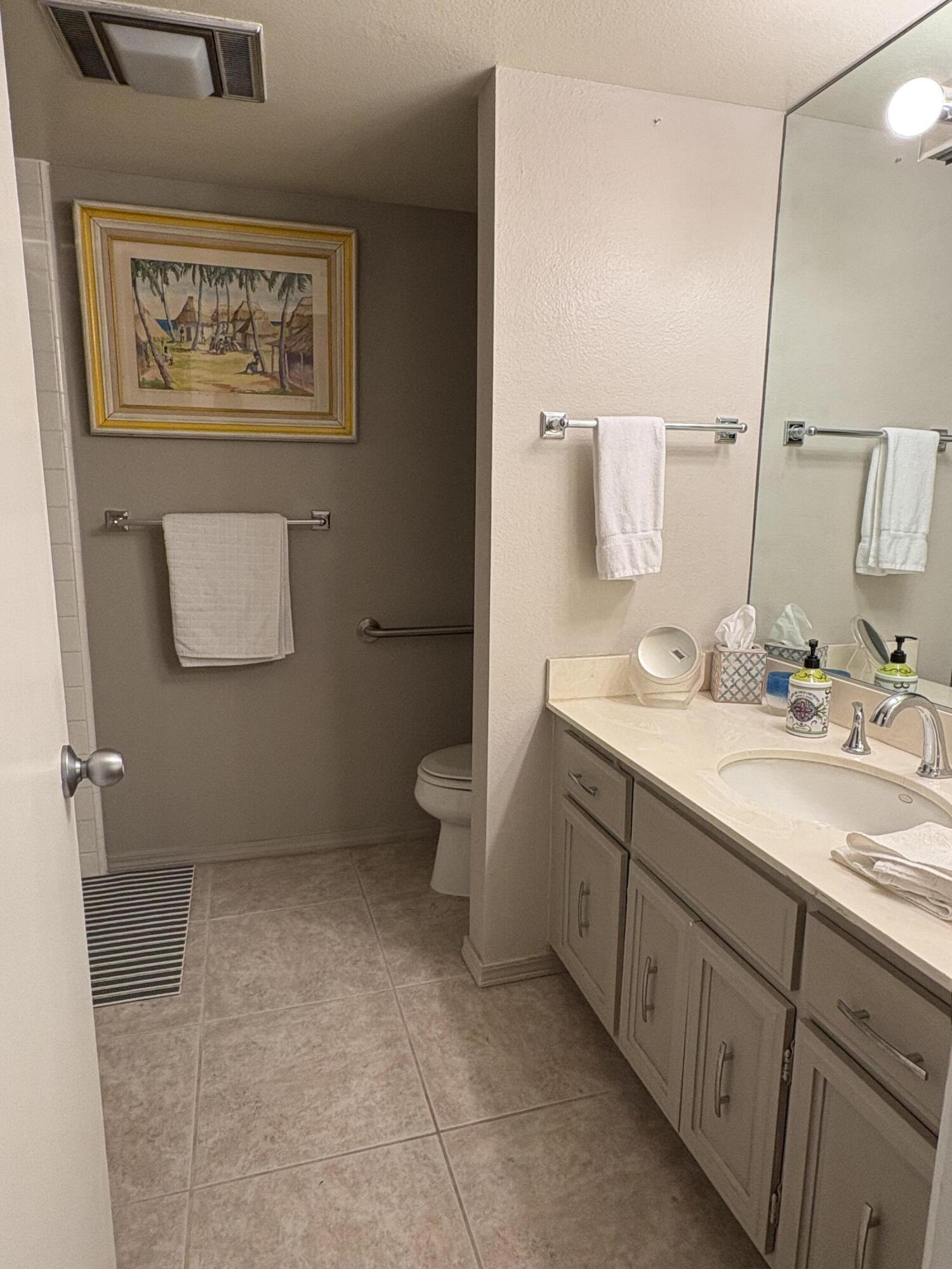 35082 Mission Hills Drive Rancho Mirage, CA 92270 - Photo 20 of 31 a bathroom with a toilet sink and mirror