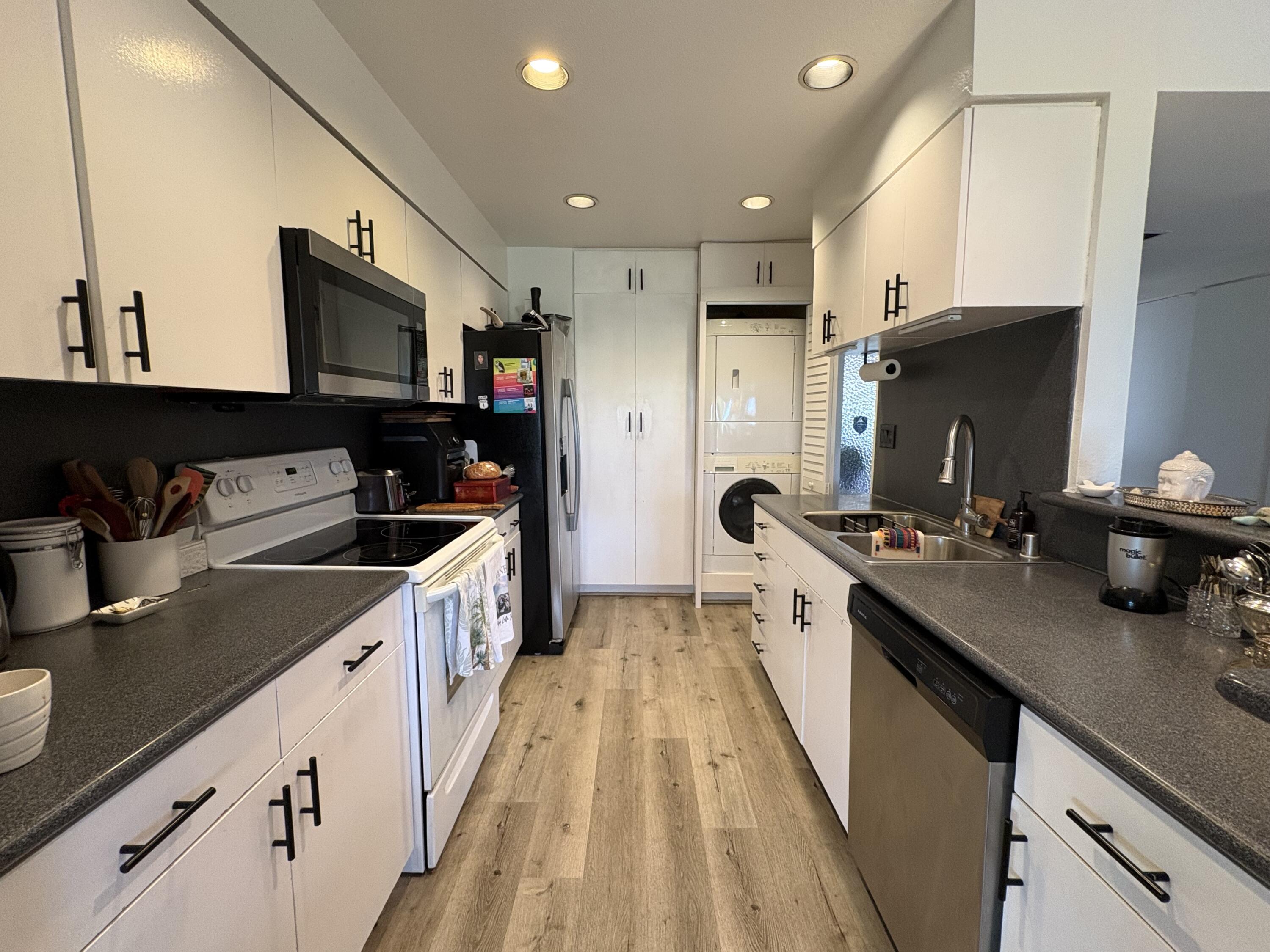 35082 Mission Hills Drive Rancho Mirage, CA 92270 - Photo 5 of 31 a large kitchen with stainless steel appliances granite countertop a lot of counter space and a sink