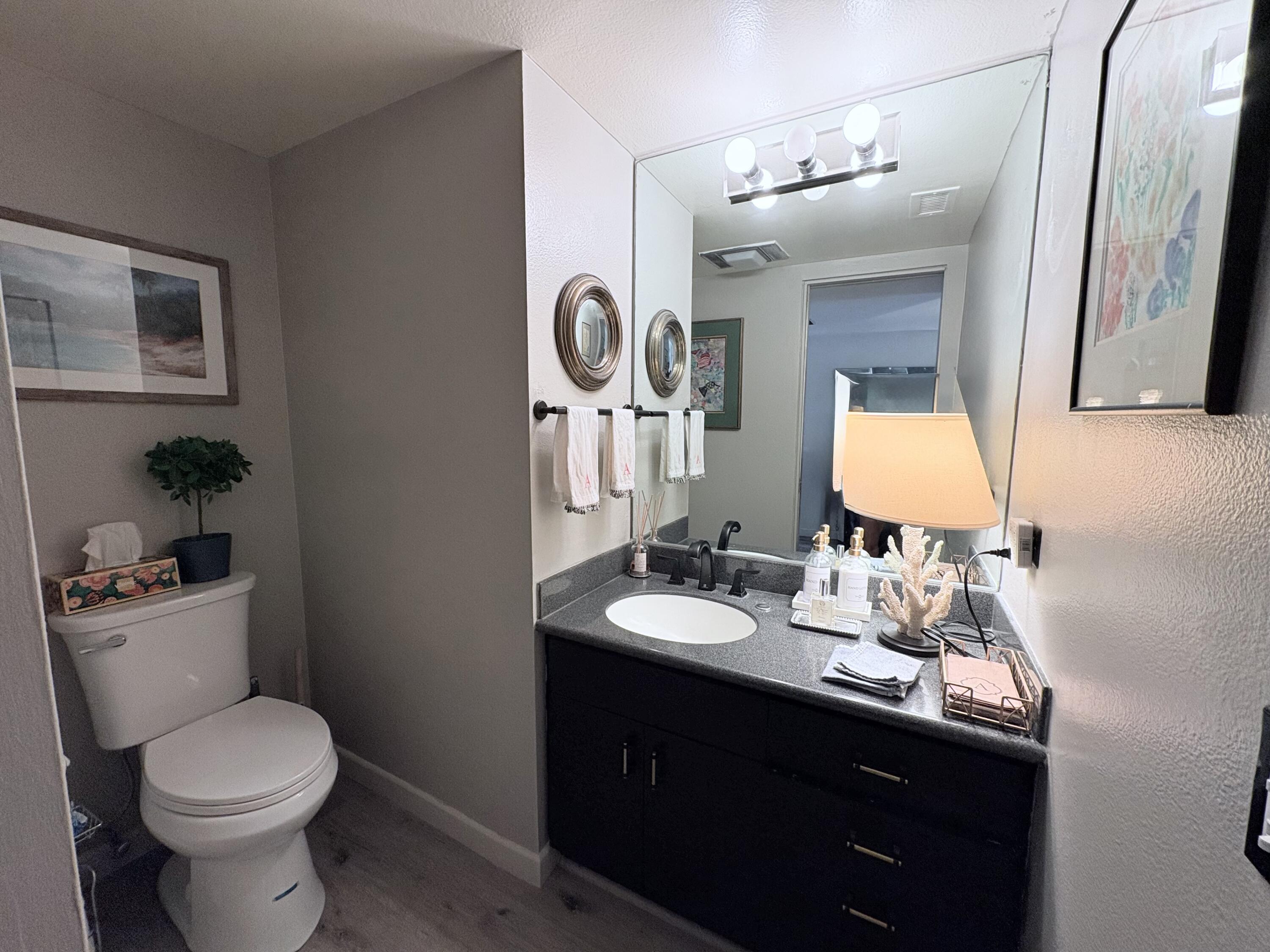 35082 Mission Hills Drive Rancho Mirage, CA 92270 - Photo 7 of 31 a bathroom with a toilet sink and mirror