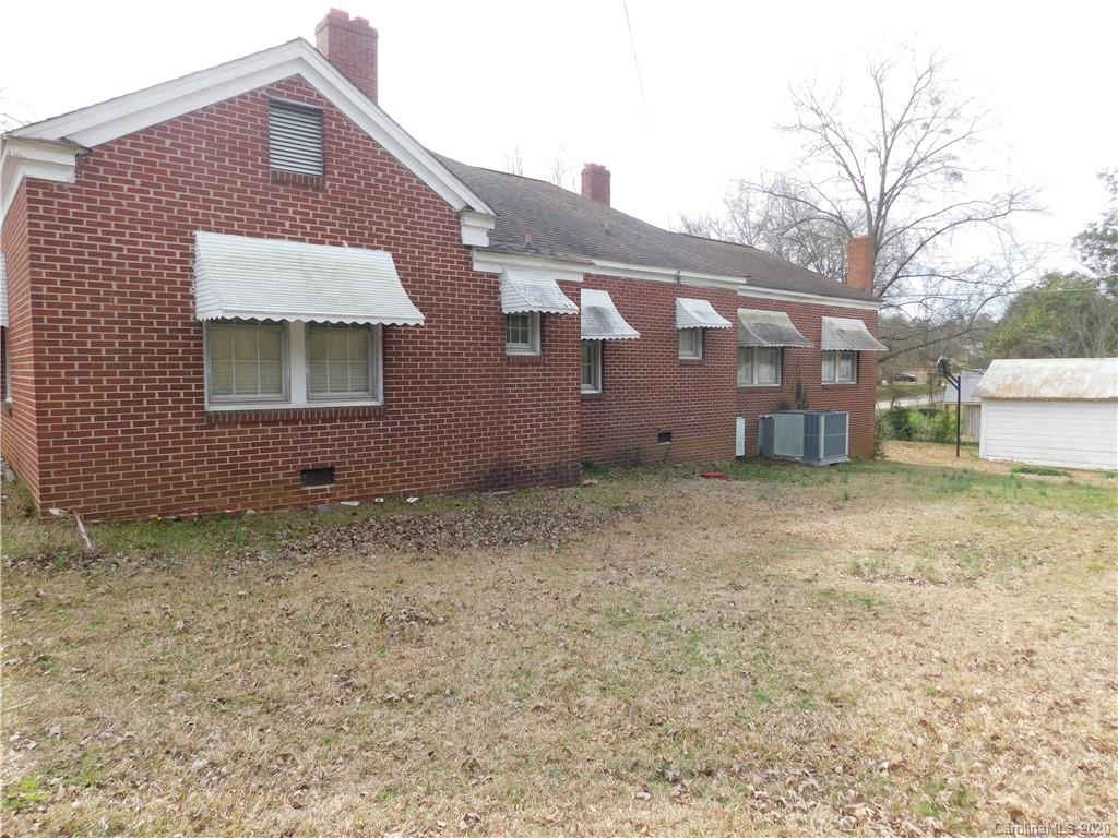 1382 Springdale Road, Unit 7 Lancaster, SC 29720 - Photo 2 of 31 a front view of a house with a yard