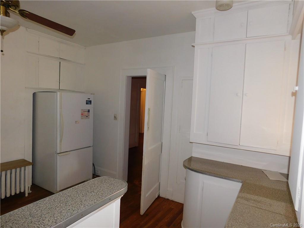 1382 Springdale Road, Unit 7 Lancaster, SC 29720 - Photo 12 of 31 a kitchen with a refrigerator and cabinets