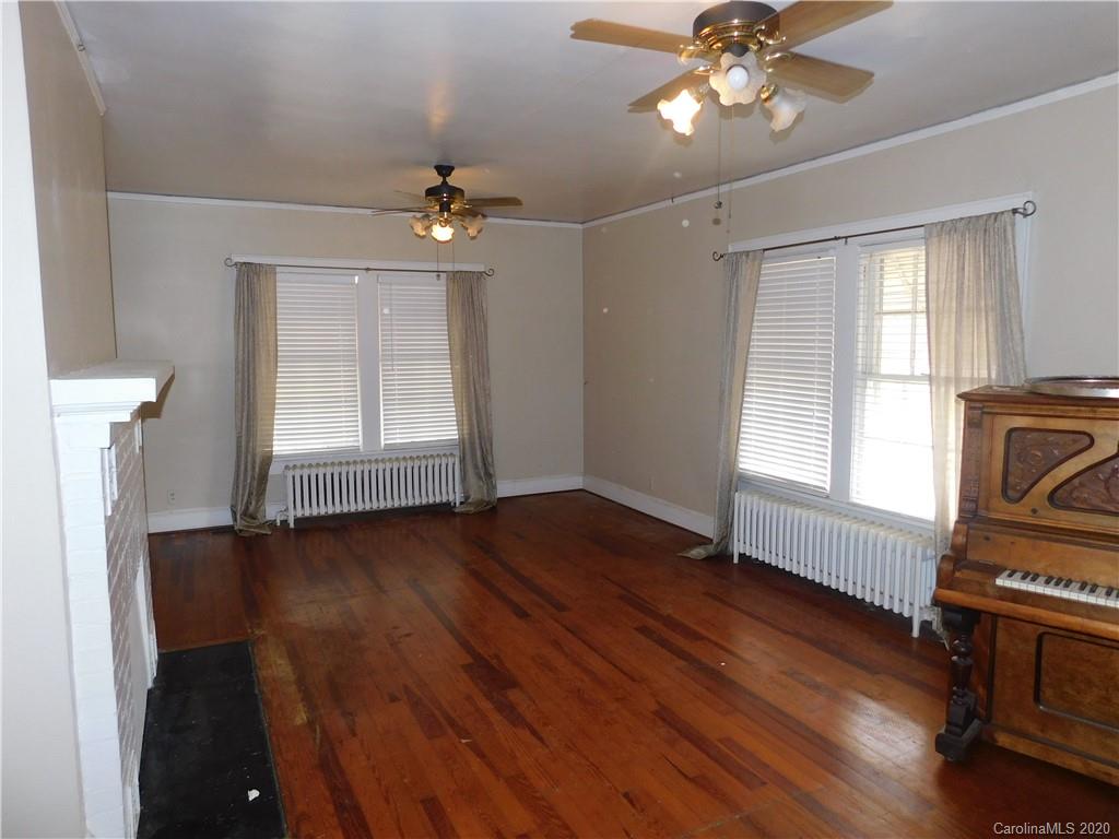 1382 Springdale Road, Unit 7 Lancaster, SC 29720 - Photo 15 of 31 a view of an empty room with wooden floor and a window