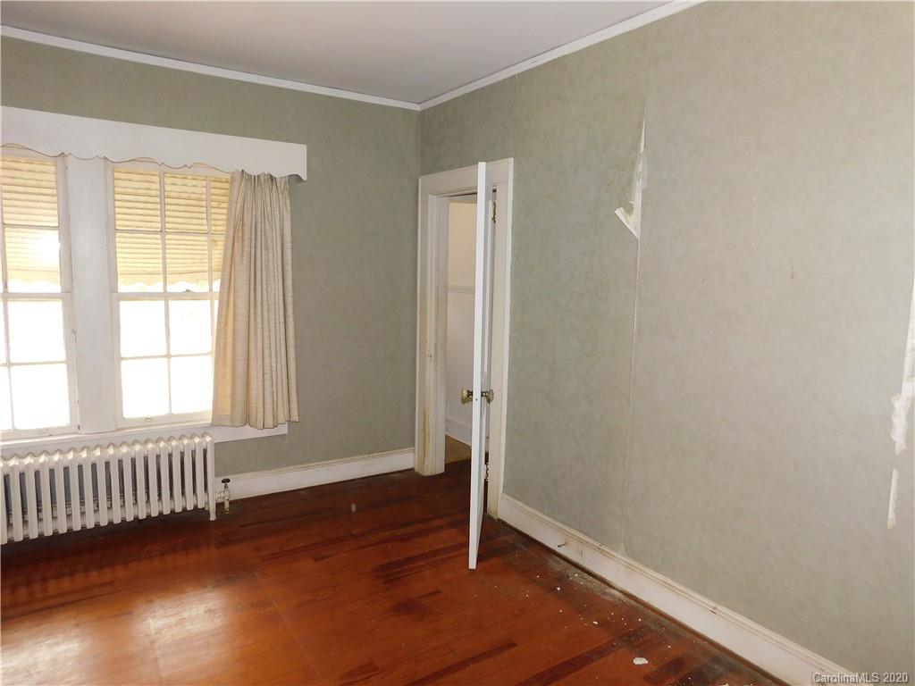 1382 Springdale Road, Unit 7 Lancaster, SC 29720 - Photo 18 of 31 an empty room with wooden floor and windows