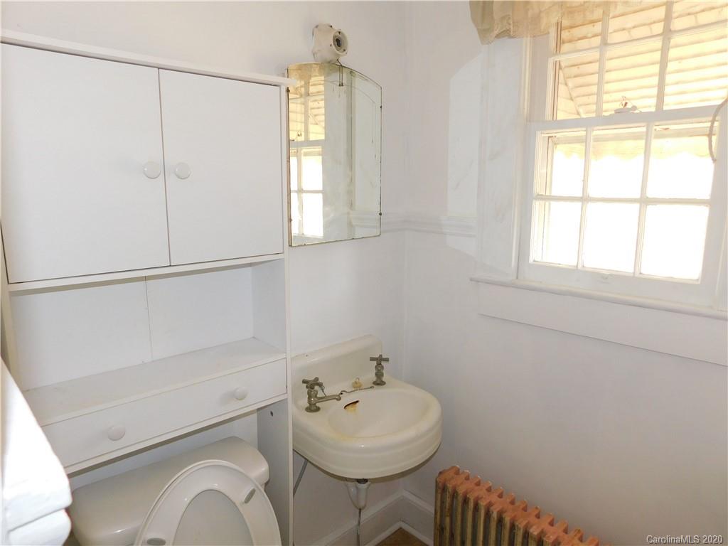 1382 Springdale Road, Unit 7 Lancaster, SC 29720 - Photo 19 of 31 a bathroom with a sink toilet and mirror