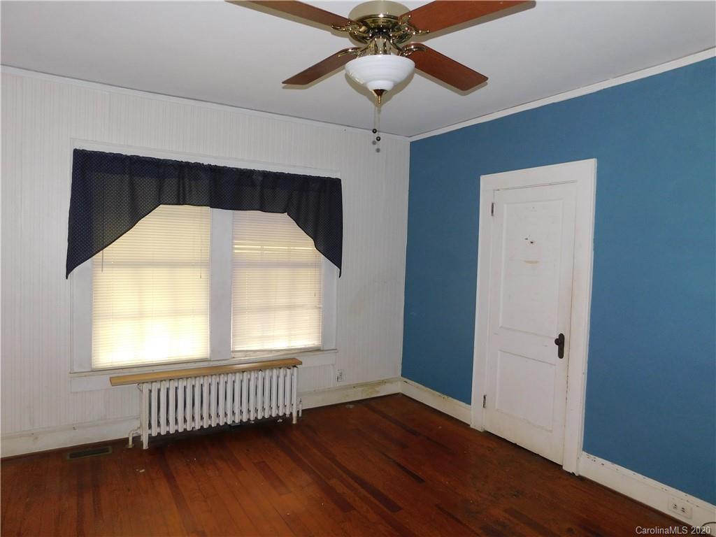1382 Springdale Road, Unit 7 Lancaster, SC 29720 - Photo 21 of 31 a view of empty room with wooden floor and fan