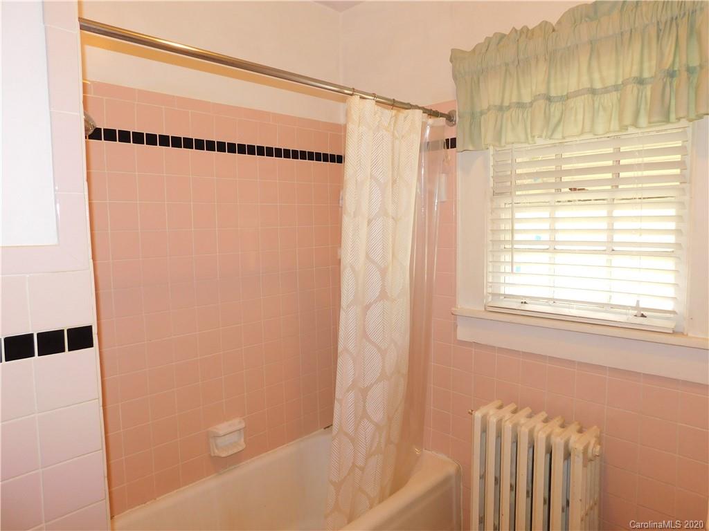 1382 Springdale Road, Unit 7 Lancaster, SC 29720 - Photo 29 of 31 a bathroom with a shower curtain and a window