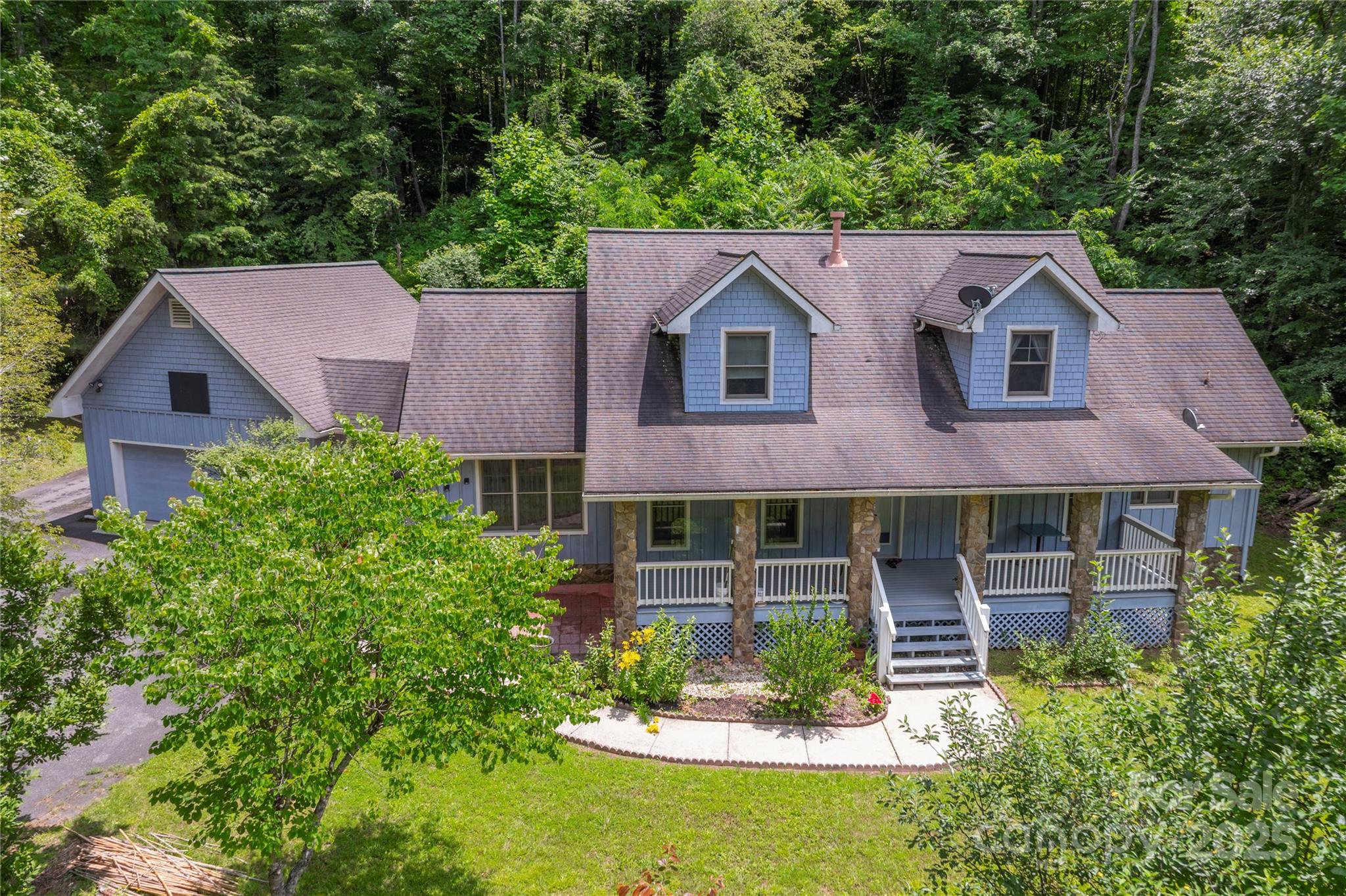 98 Choga Ridge Whittier, NC 28789 - Photo 1 of 28 a aerial view of a house with a yard and potted plants