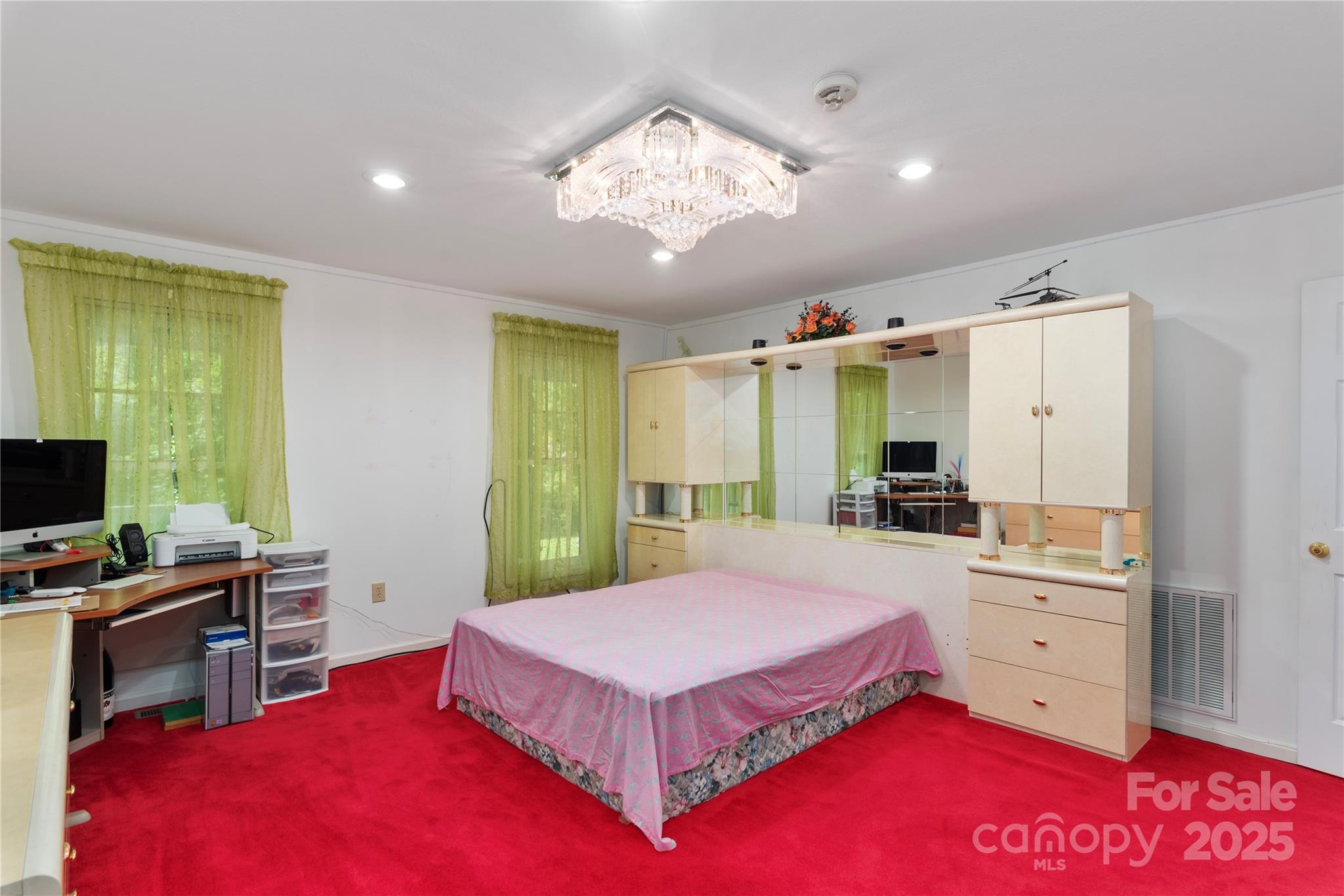 98 Choga Ridge Whittier, NC 28789 - Photo 14 of 28 a bedroom with a large bed and a chandelier