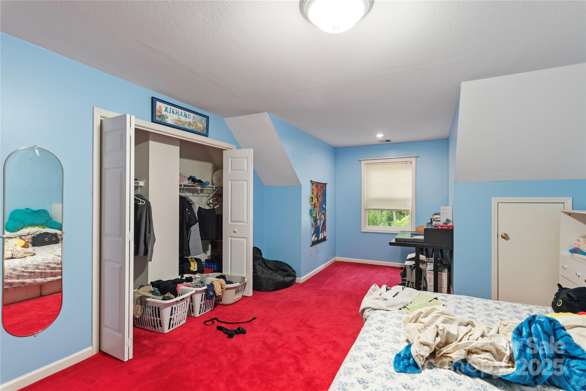 98 Choga Ridge Whittier, NC 28789 - Photo 21 of 28 a bedroom with bed and a large mirror