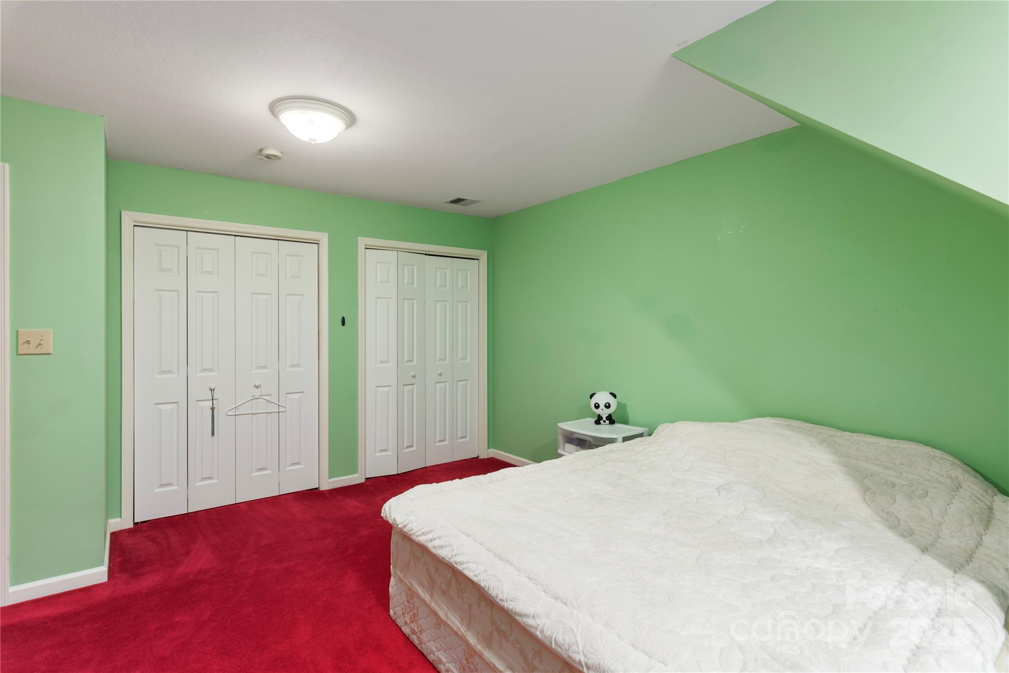 98 Choga Ridge Whittier, NC 28789 - Photo 25 of 28 a bedroom with a bed and a closet