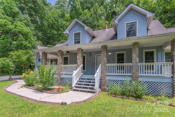 a front view of a house with a garden