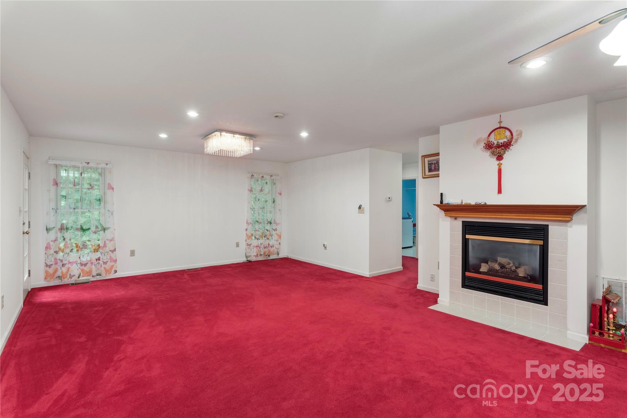 98 Choga Ridge Whittier, NC 28789 - Photo 7 of 28 a view of an empty room with a fireplace