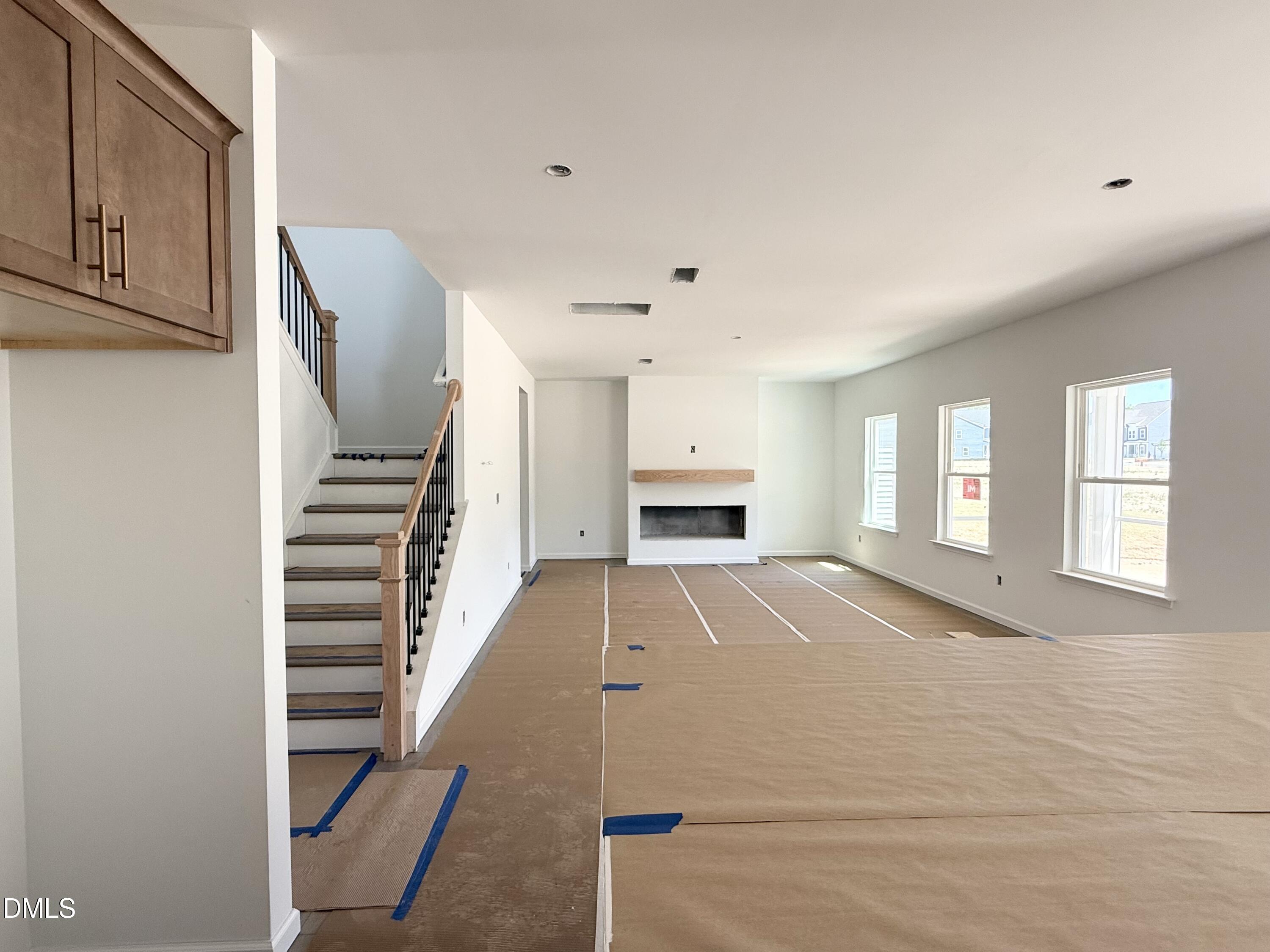 941 Fetching Place, Unit 370 Rolesville, NC 27571 - Photo 5 of 24 a view of kitchen and hall with wooden floor