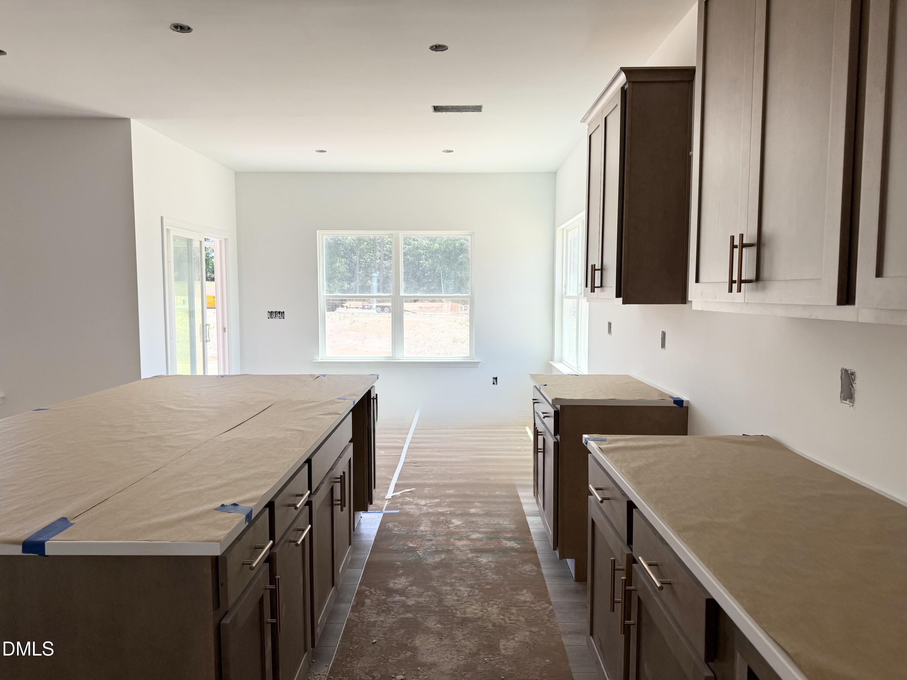 941 Fetching Place, Unit 370 Rolesville, NC 27571 - Photo 6 of 24 a kitchen with a sink a stove and a refrigerator
